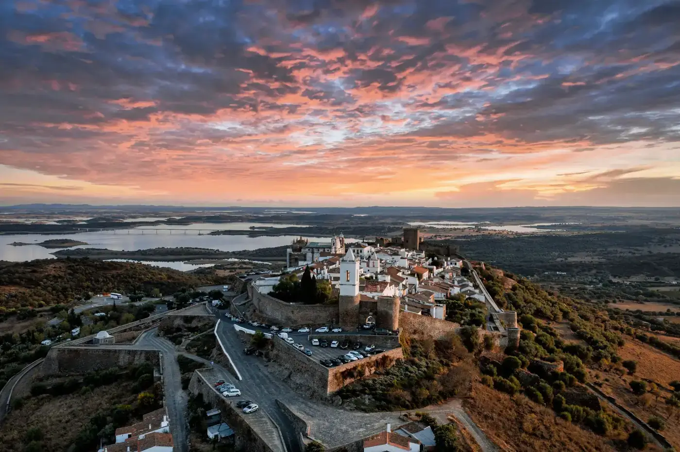 Explore the stunning sunset over Monsaraz village in Évora, Portugal.