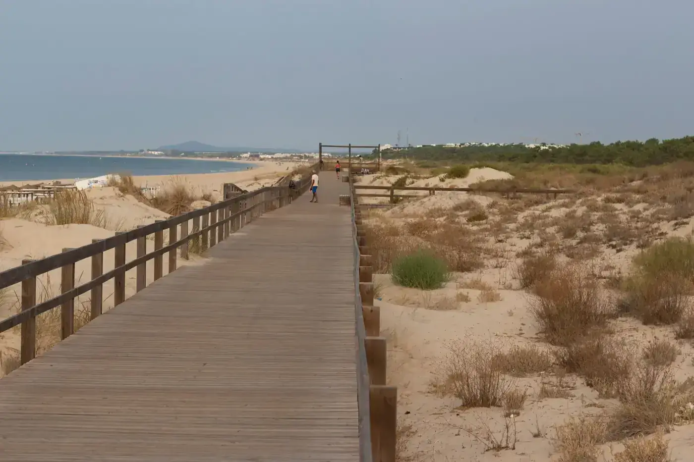 Beautiful boardwalk along Monte Gordo Beach in Faro, Portugal, offering coastal views.