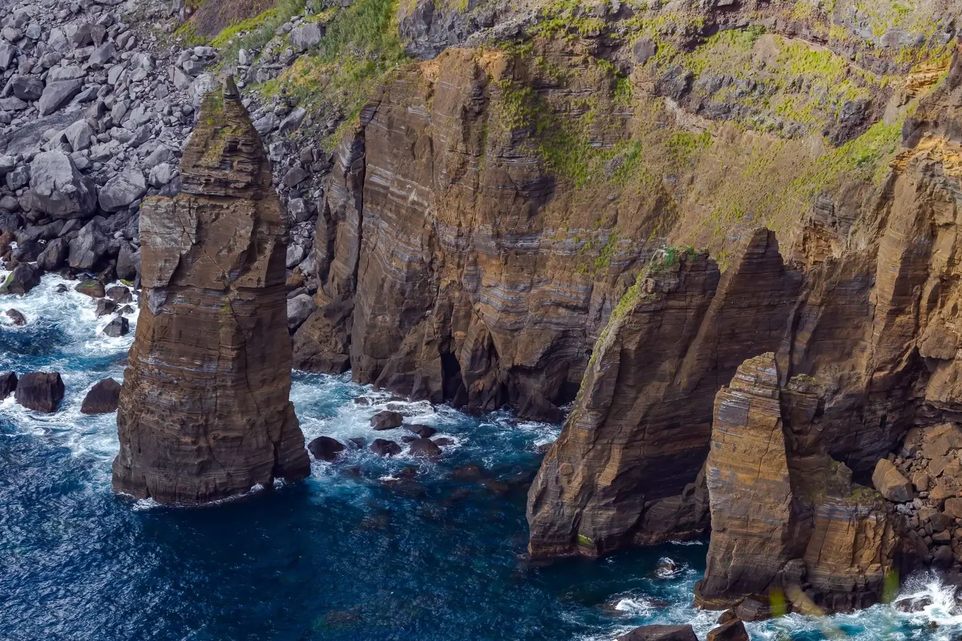 Explore the breathtaking rock formations and cliffs along the coast of São Miguel in the Azores, Portugal.