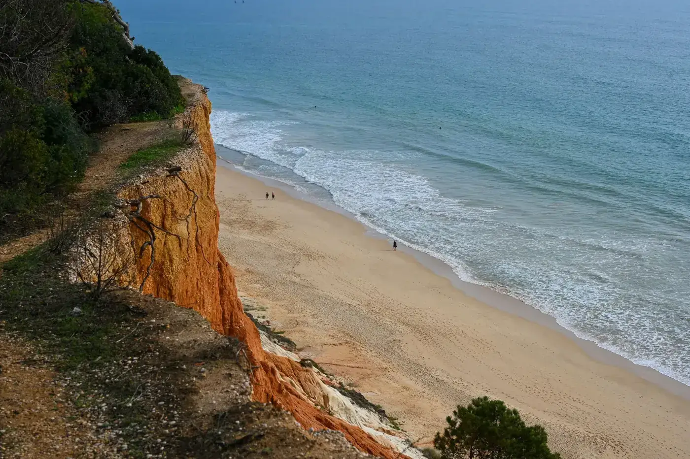 Dramatic cliffs overlooking the beautiful beaches of Faro, Portugal.