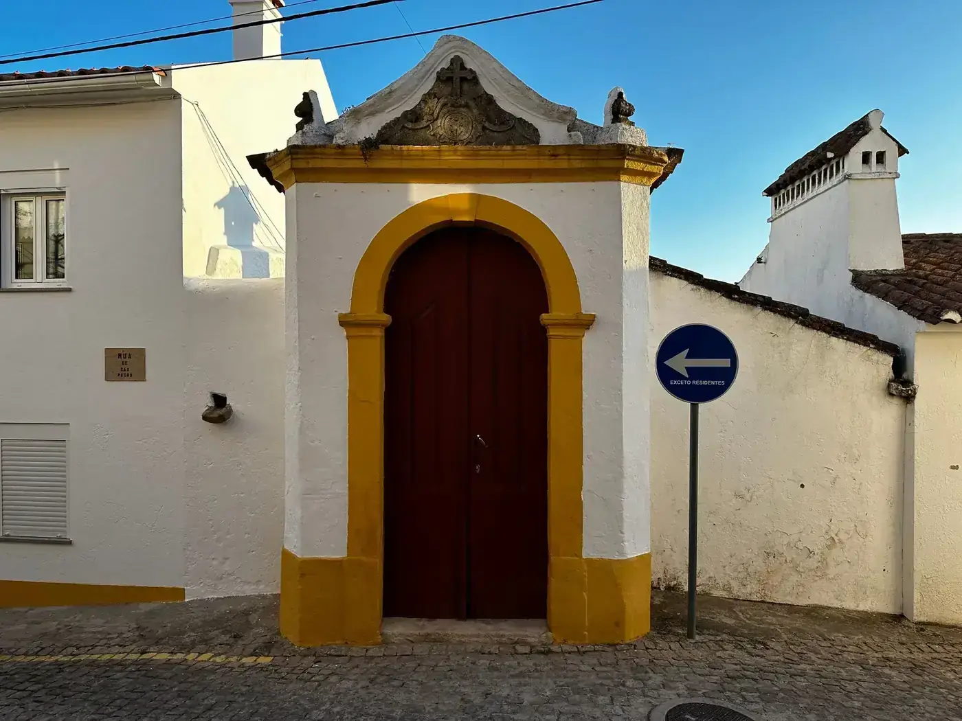 Capture of a traditional antique doorway in Castelo de Vide, adorned with Portuguese architecture.