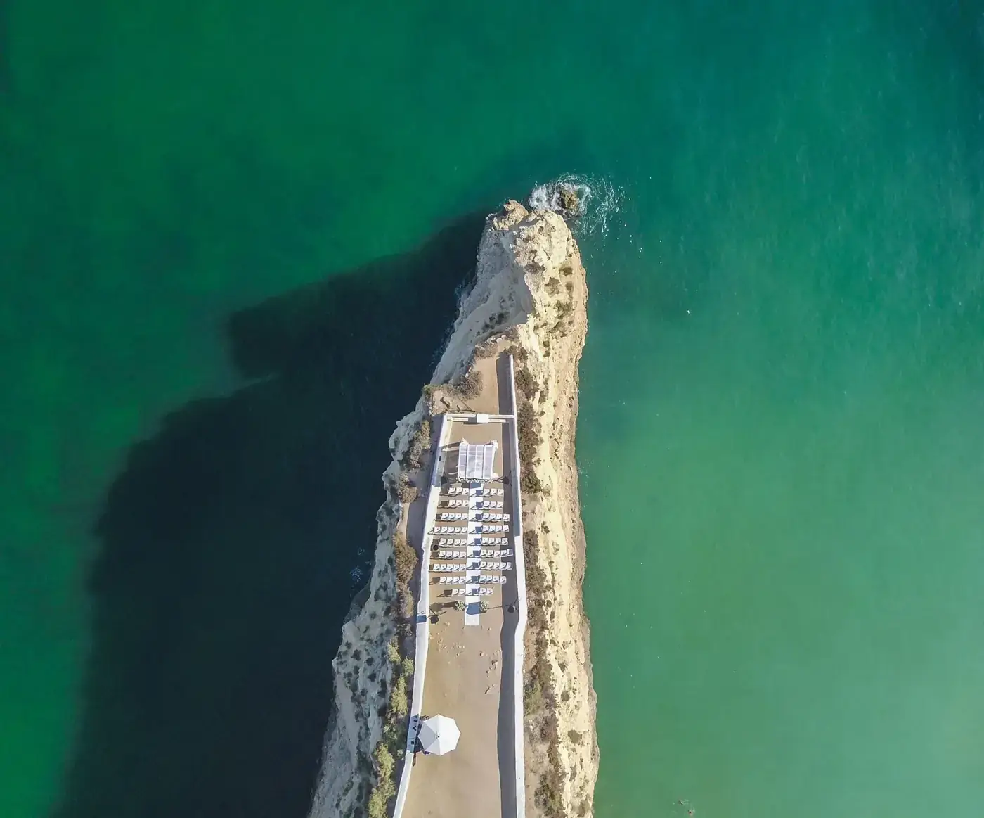 Drone view of Fort of Nossa Senhora da Rocha on a rocky coastline in Porches, Faro, Portugal.
