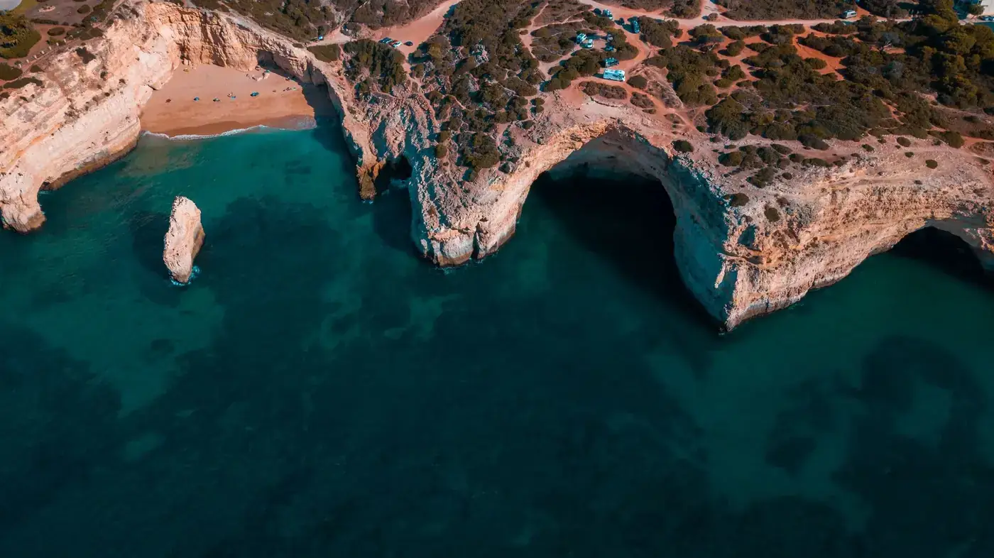 Bird's-eye view of the stunning cliffs and beach at Praia do Carvalho, Algarve, Portugal.