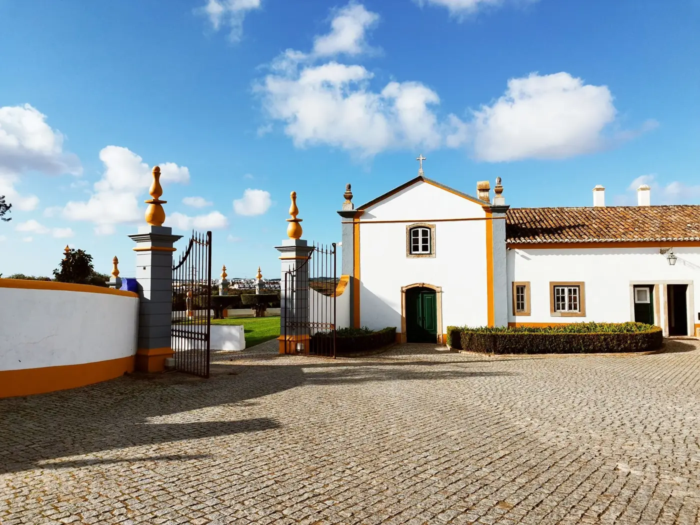Quinta at Carvalhal, Portugal with blue sky and vibrant sunlight.