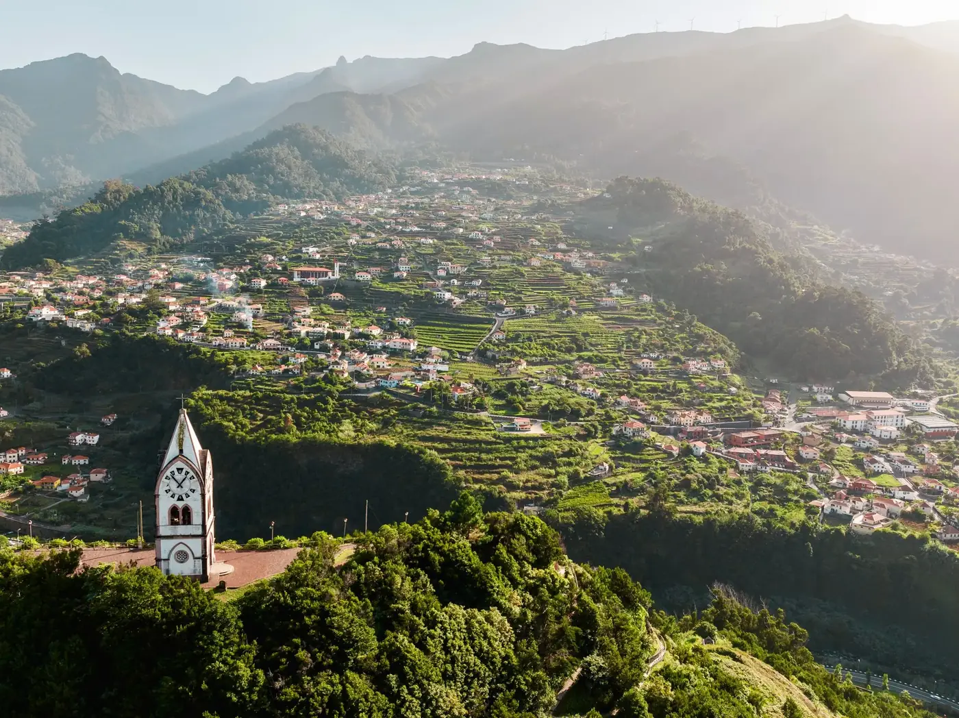A breathtaking aerial view of the lush, mountainous landscape of Funchal, Madeira, Portugal.