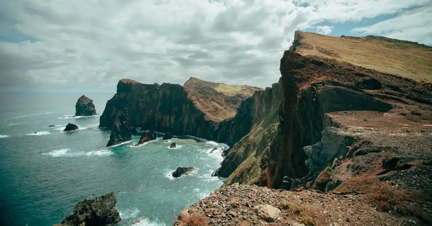 Stunning cliffs at Madeira, Portugal with Atlantic Ocean view, perfect for nature and travel enthusiasts.